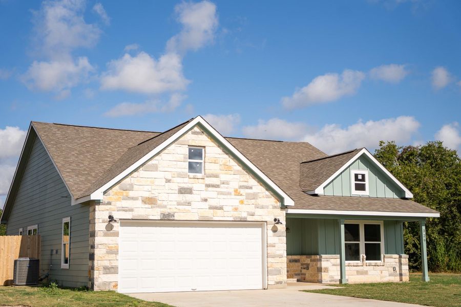 Front exterior of a new home in , Smithville, TX, highlighting curb appeal (Image 20).