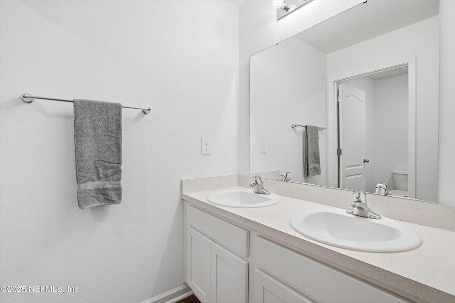 Furnished interior view inside a new home in Cross Creek Express, Green Cove Springs (Image 11).