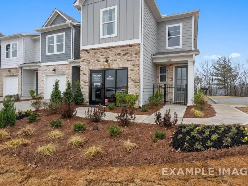 Front exterior of a new home in Townes at North Main, Lillington, NC, highlighting curb appeal (Image 2). Front exterior of a new home in Townes at North Main, Lillington, NC, highlighting curb appeal (Image 2).