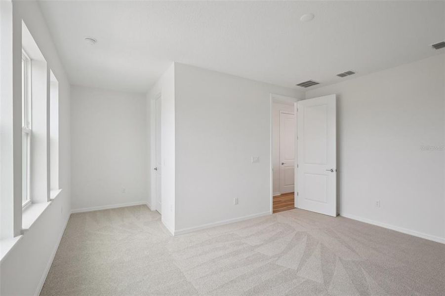 Spacious, unfurnished interior of a new home in Primrose at Longleaf, New Port Richey (Image 36).