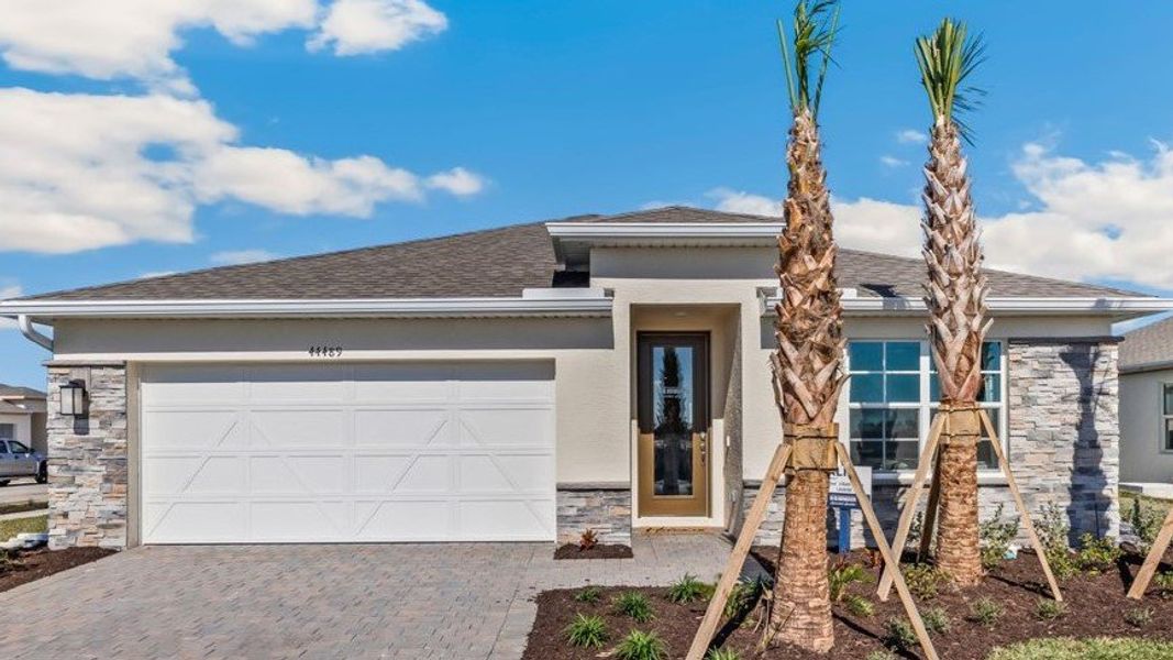 Representative exterior photo of a completed home built from the CALI by D.R. Horton in Cali Cove, Punta Gorda, FL (Image 2).