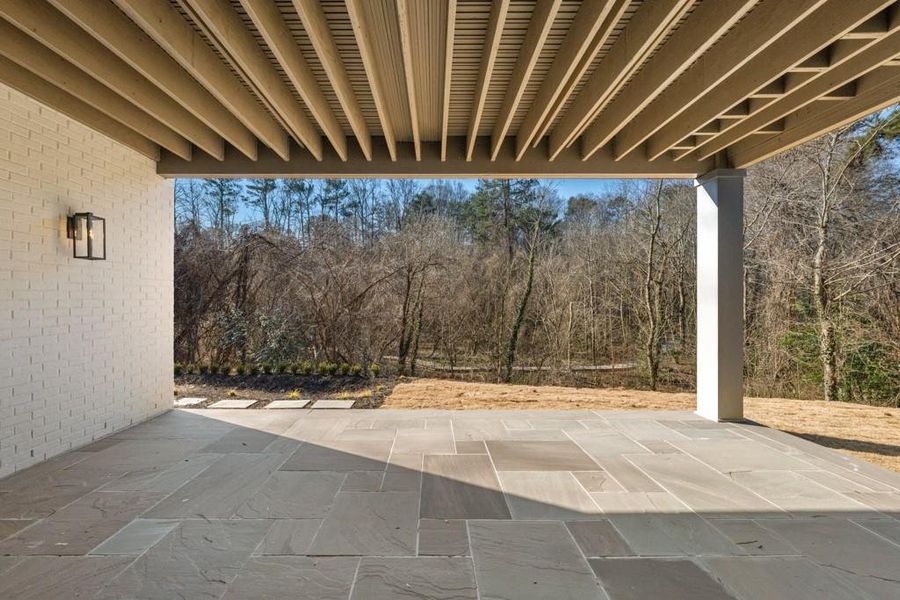 Exterior details and patio area of a home in Blue Heron Walk, Atlanta (Image 25).