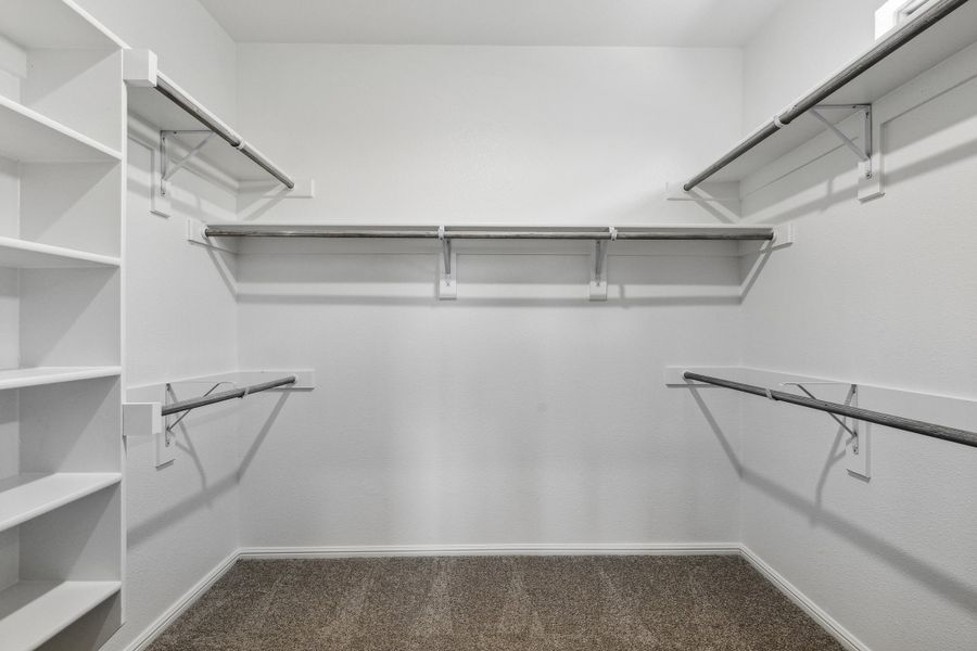 Primary closet in the Sapphire home plan by Trophy Signature Homes – REPRESENTATIVE PHOTO