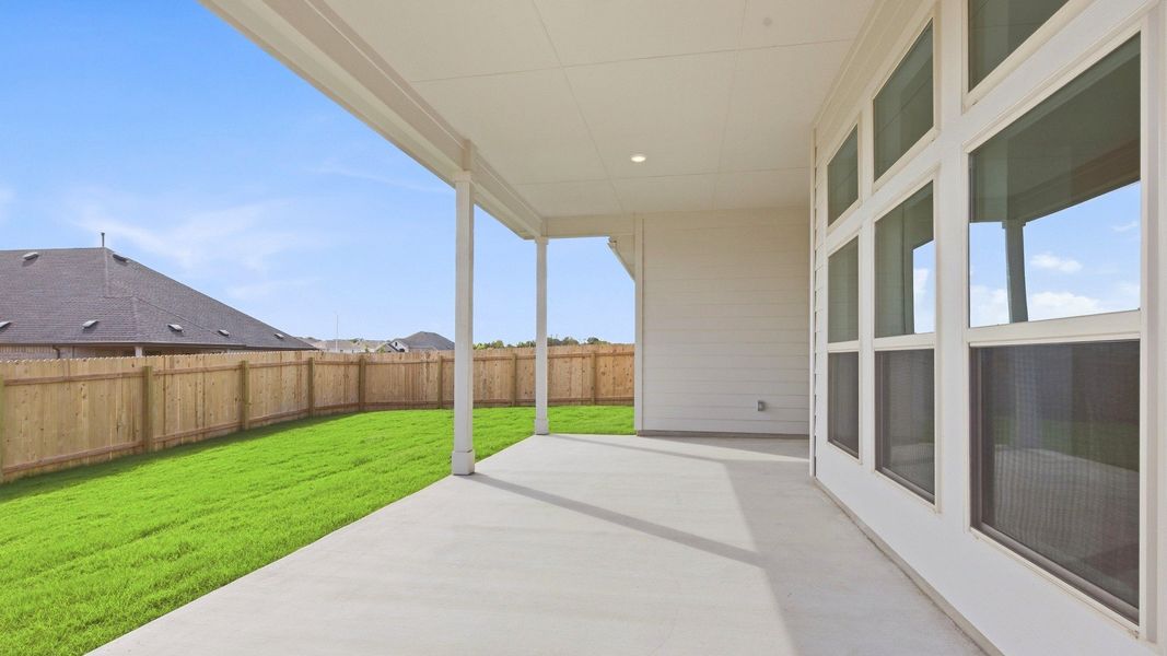 Exterior details and patio area of a home in Carillon, Manor (Image 4).