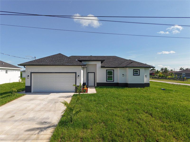 Front exterior of a new home in , Lehigh Acres, FL, highlighting curb appeal (Image 2). Front exterior of a new home in , Lehigh Acres, FL, highlighting curb appeal (Image 2).
