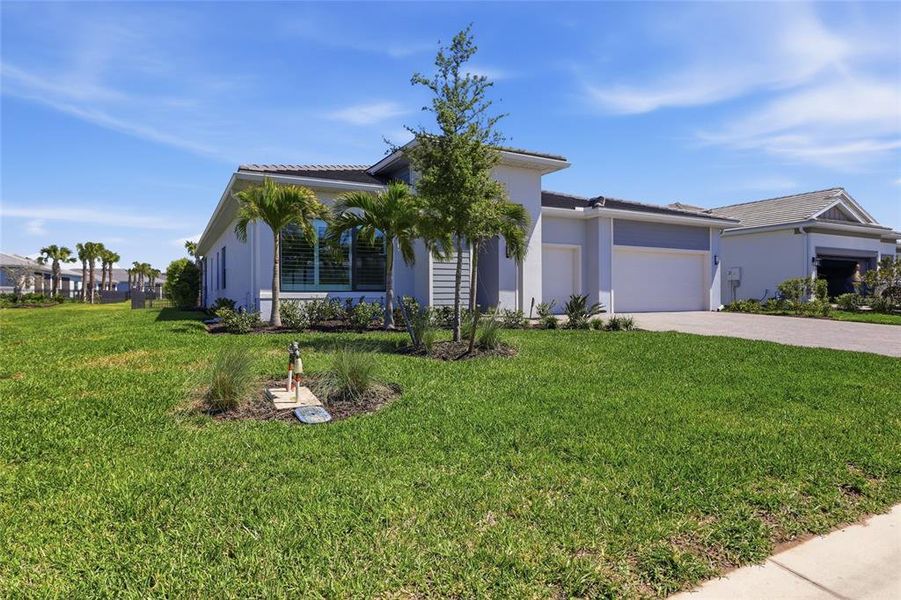Front exterior of a new home in , Lakewood Ranch, FL, highlighting curb appeal (Image 21).