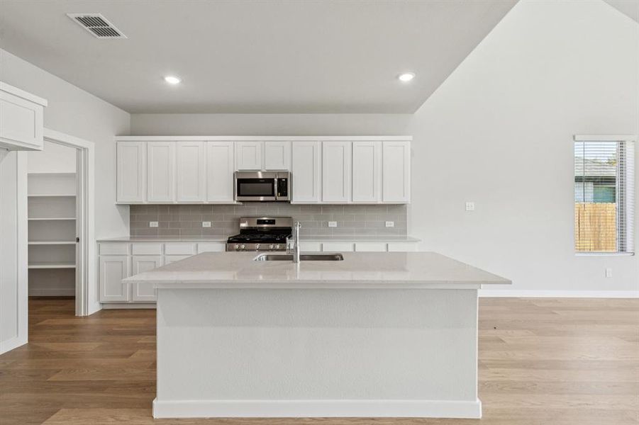 Kitchen in the Winters home plan by Trophy Signature Homes – REPRESENTATIVE PHOTO Kitchen in the Winters home plan by Trophy Signature Homes – REPRESENTATIVE PHOTO