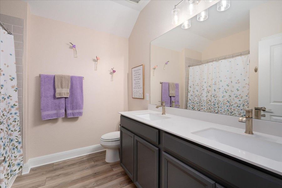 Bathroom 2 has a double vanity, perfect for when 2 people need to get ready at the same time!