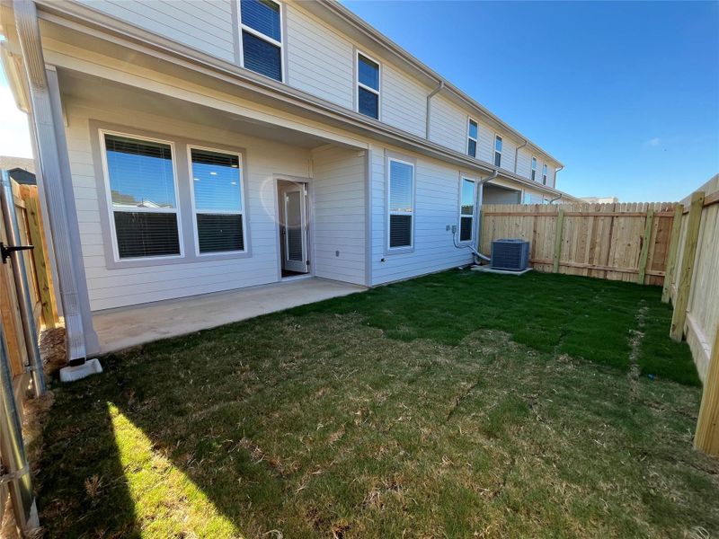 Back of house with a patio and a fenced backyard
