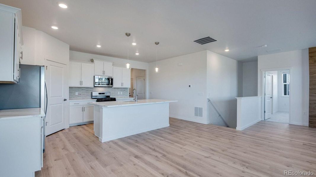 Furnished interior view inside a new home in Trails at Crowfoot, Parker (Image 12).
