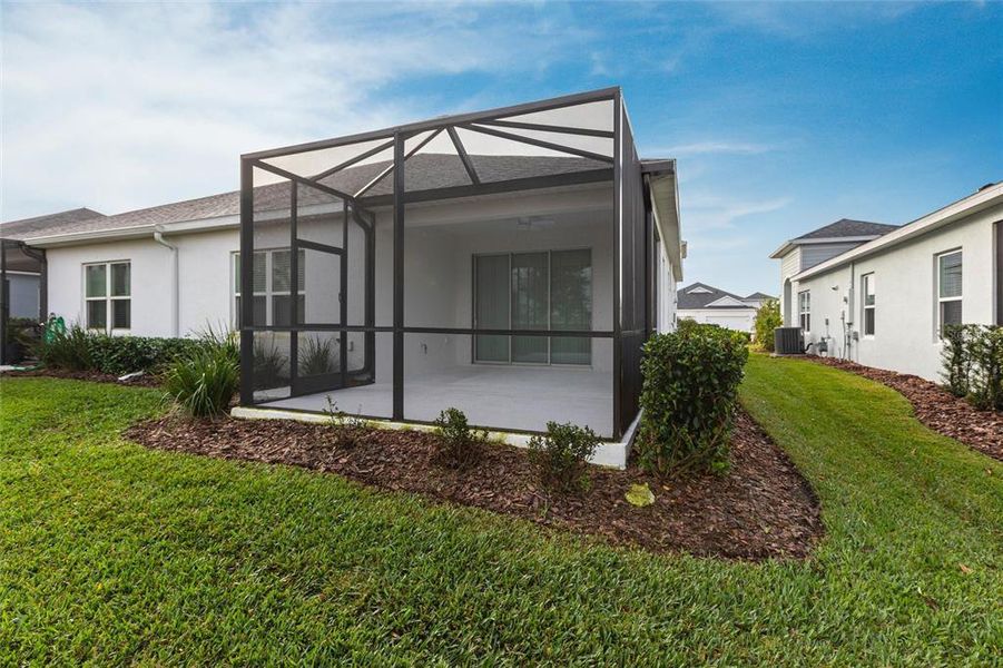 Exterior details and patio area of a home in Canoe Creek, Parrish (Image 2).