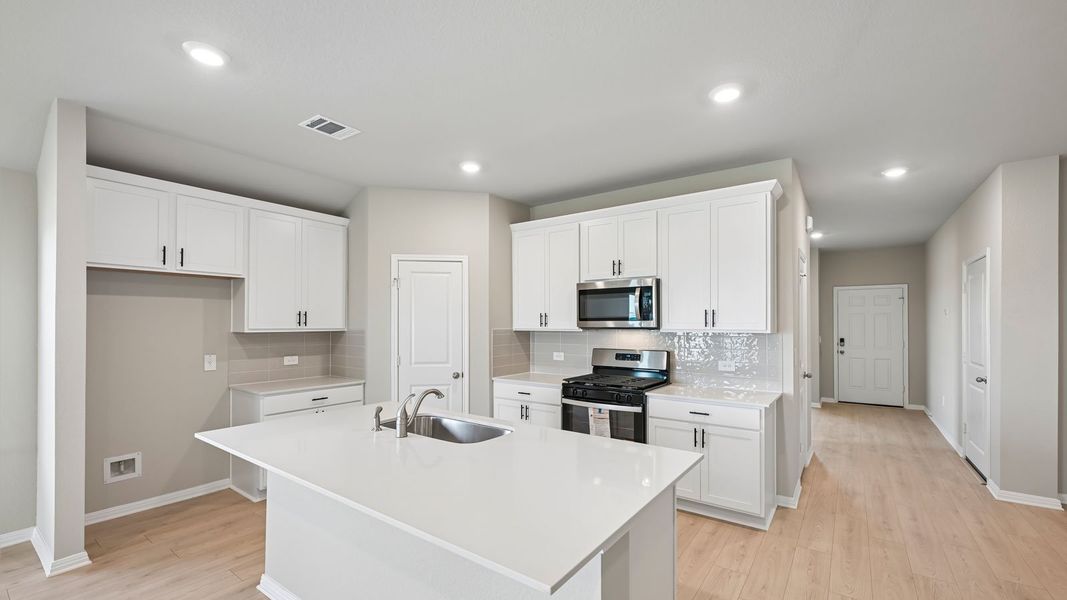 Furnished interior view inside a new home in Carillon, Manor (Image 7).