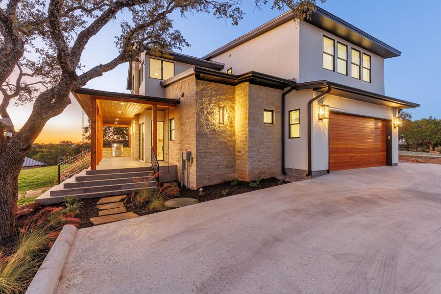 Front exterior of a new home in , Horseshoe Bay, TX, highlighting curb appeal (Image 26). Front exterior of a new home in , Horseshoe Bay, TX, highlighting curb appeal (Image 26).