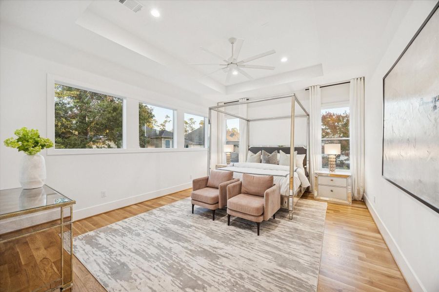 Vaulted ceilings and expansive windows create a calm, light filled primary suite designed for rest and retreat. Generous floor space allows for a seating area or workout nook, while thoughtful layout keeps the sleeping area quiet and separate from the bath and closets. Vaulted ceilings and expansive windows create a calm, light filled primary suite designed for rest and retreat. Generous floor space allows for a seating area or workout nook, while thoughtful layout keeps the sleeping area quiet and separate from the bath and closets.