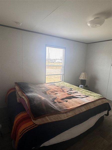 Bedroom featuring crown molding Bedroom featuring crown molding