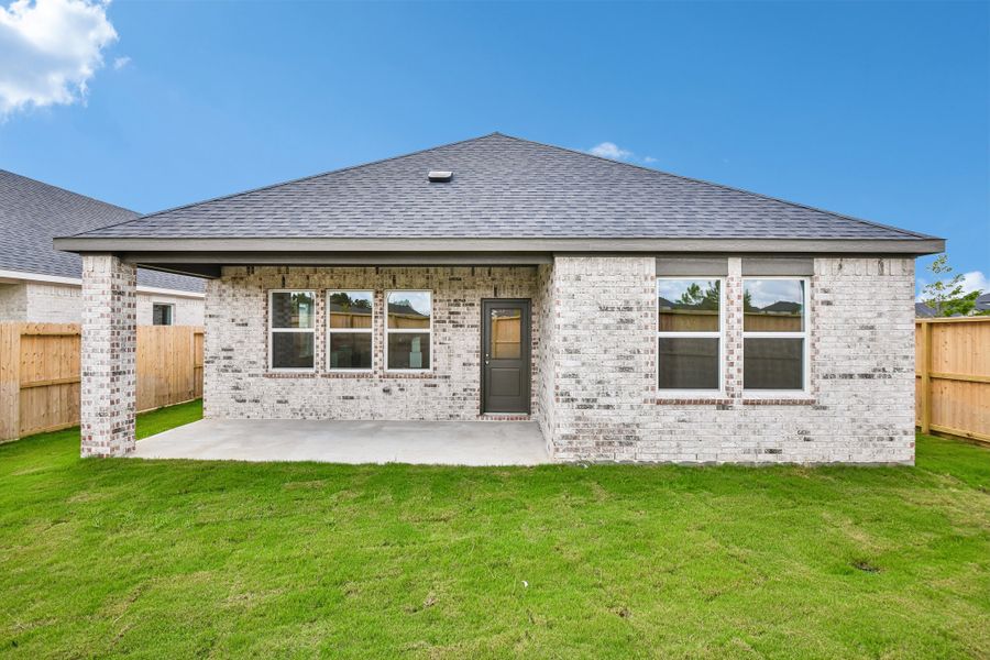 Exterior details and patio area of a home in Raburn Reserve 50s, Tomball (Image 19).
