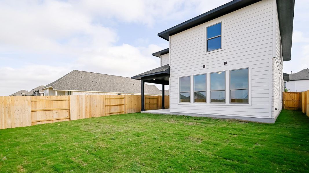 Back of property featuring a patio area and a fenced backyard Back of property featuring a patio area and a fenced backyard