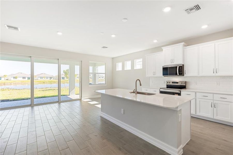 Furnished interior view inside a new home in Coral Lakes - Tradition & Express, Punta Gorda (Image 9).