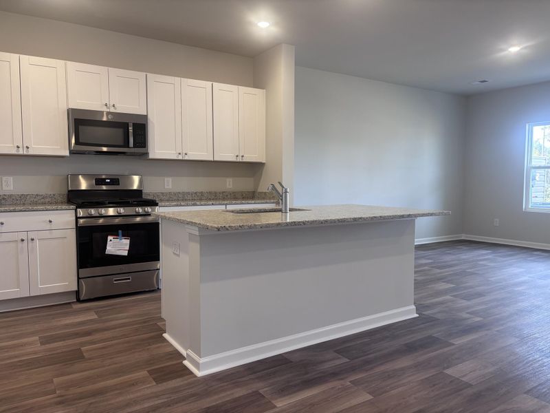 Furnished interior view inside a new home in Lindera Preserve at Cane Bay Plantation: Townhomes, Summerville (Image 7). Furnished interior view inside a new home in Lindera Preserve at Cane Bay Plantation: Townhomes, Summerville (Image 7).