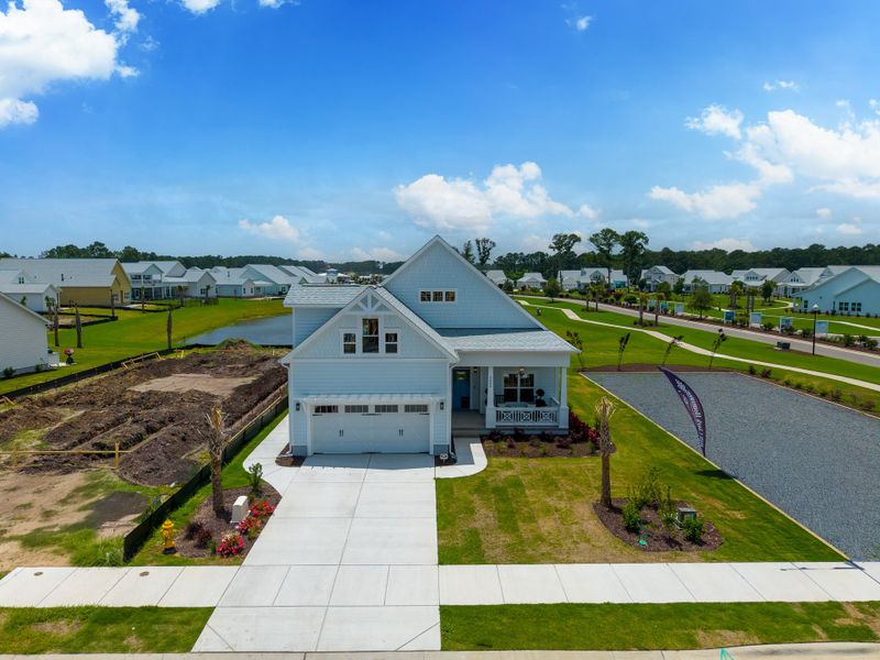 Front exterior of a new home in The Sanctuary at Sunset Beach, Sunset Beach, NC, highlighting curb appeal (Image 27).