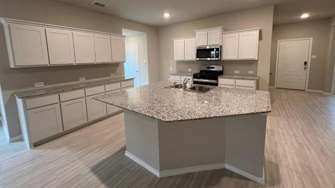 Kitchen-All Home and community information, including pricing, included features, terms, availability and amenities, are subject to change at any time without notice or obligation. All Drawings, pictures, photographs, video, square footages, floor plans, elevations, features, colors and sizes are approximate for illustration purposes only and will vary from the homes as built.