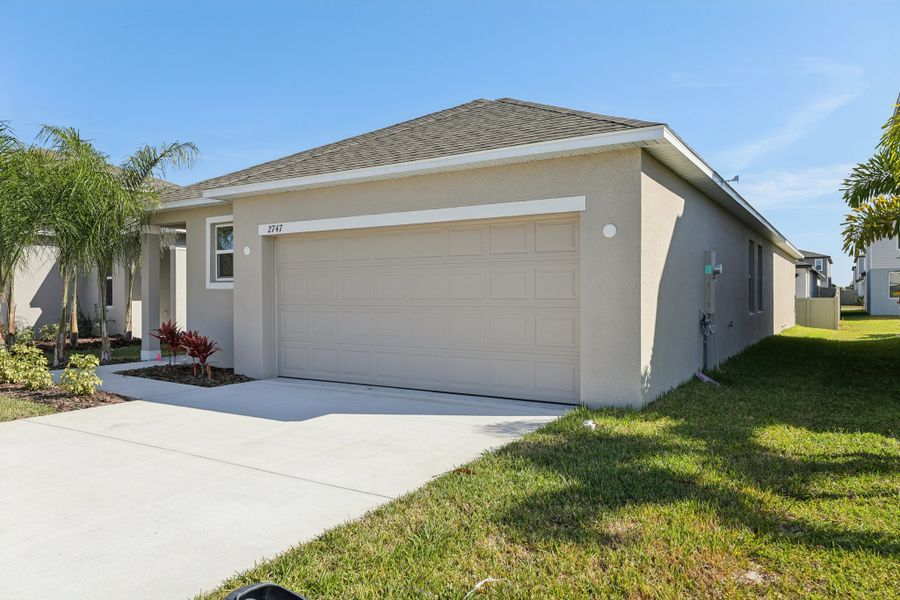 Representative exterior photo of a completed home built from the Vista by Maronda Homes in Heritage Station, Punta Gorda, FL (Image 19).
