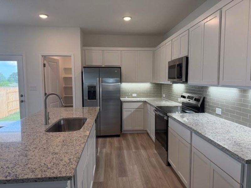 Furnished interior view inside a new home in Grande Estates, Bertram (Image 7). Furnished interior view inside a new home in Grande Estates, Bertram (Image 7).