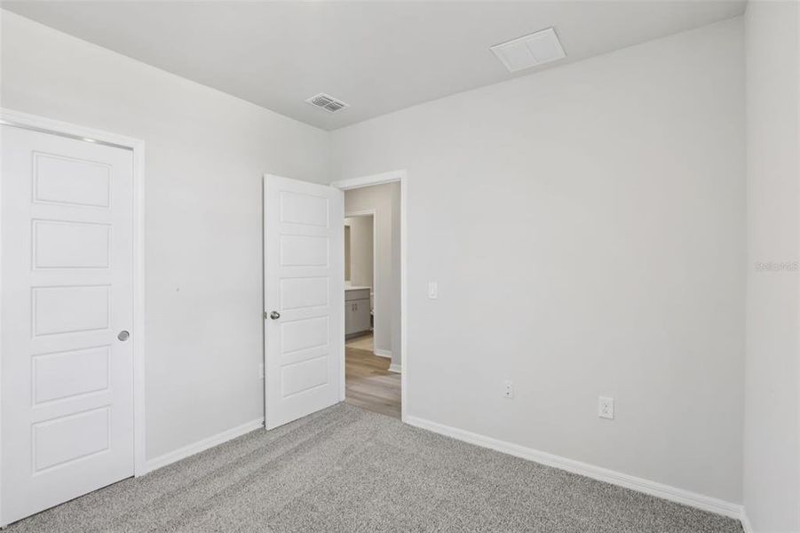 Spacious, unfurnished interior of a new home in Crescent Lakes - Premier Series, Punta Gorda (Image 23).