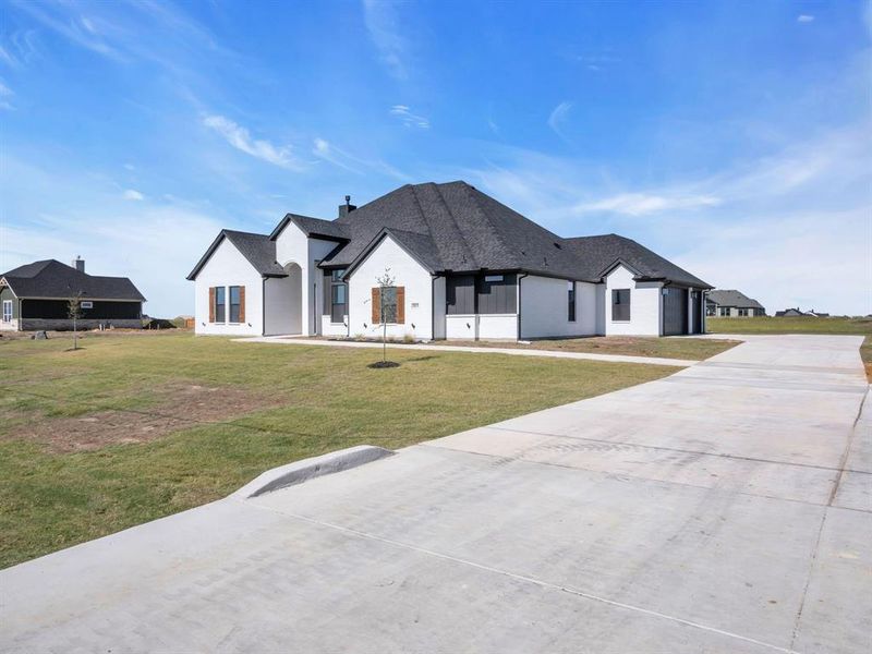 French country style house with a front yard