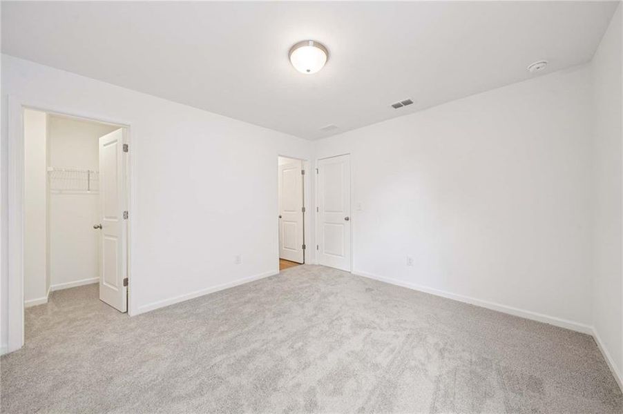 Spacious, unfurnished interior of a new home in Eastlyn Crossing, Flowery Branch (Image 24).