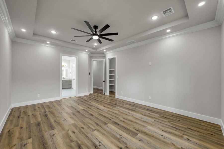 The owner’s retreat with tray ceiling and serene color palette. The owner’s retreat with tray ceiling and serene color palette.