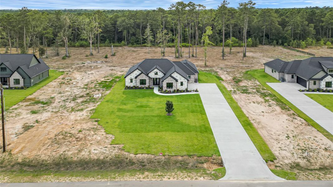 Front exterior of a new home in , Conroe, TX, highlighting curb appeal (Image 17).