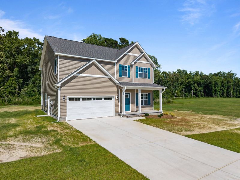 Front exterior of a new home in Laurel Oaks, Greenville, NC, highlighting curb appeal (Image 1). Front exterior of a new home in Laurel Oaks, Greenville, NC, highlighting curb appeal (Image 1).