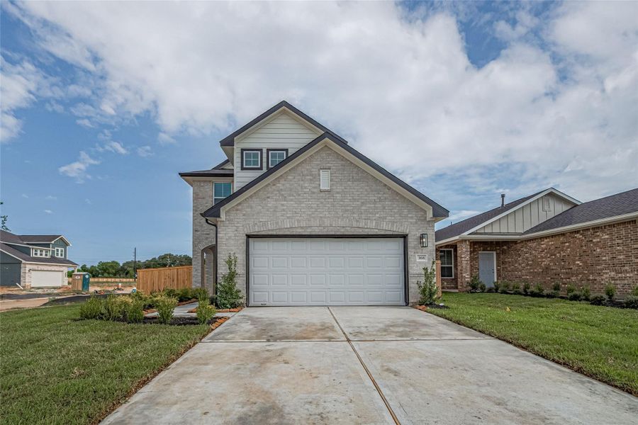 Front exterior of a new home in La Segarra, Brookshire, TX, highlighting curb appeal (Image 28).