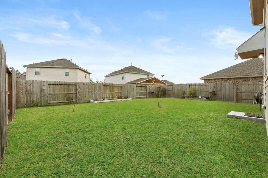 Exterior details and patio area of a home in Tavola: Gulf Coast Collection, New Caney (Image 2).