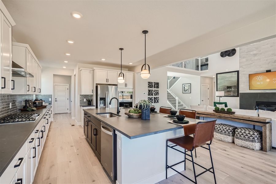 A kitchen with a bar and island. A kitchen with a bar and island.