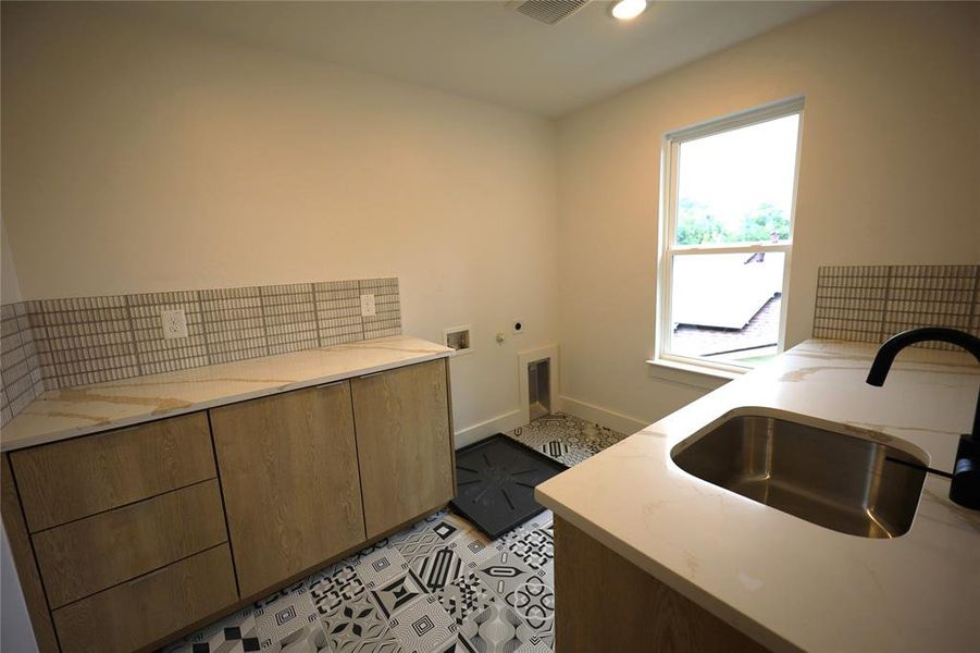 Laundry area featuring hookup for an electric dryer, washer hookup, recessed lighting, and light tile patterned floors