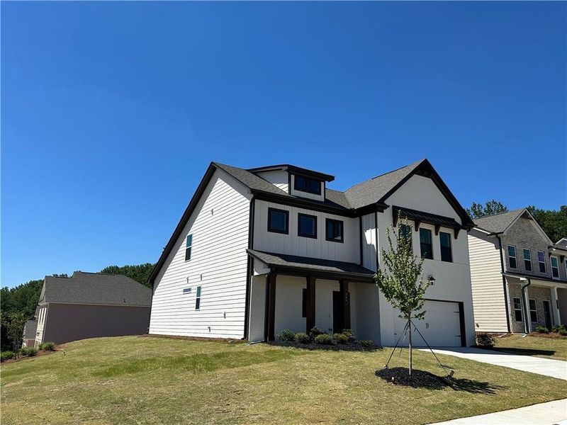 Front exterior of a new home in Summerlin, Winder, GA, highlighting curb appeal (Image 27).