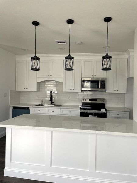 kitchen with designer's breakfast island, neat and tidy