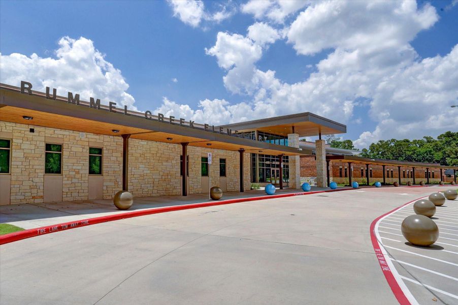 Rummel Creek Elementary presents a welcoming campus with modern architectural lines, stone detailing, and a covered entry drive. Clean landscaping and expansive grounds reflect pride of ownership and community investment. Zoned to this highly regarded Spring Branch ISD school, residents enjoy access to one of Memorial’s most sought-after educational environments.
