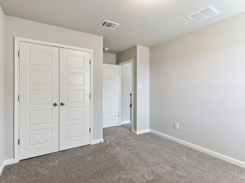 Guest bedroom in the Matador floorplan at a Meritage Homes community.