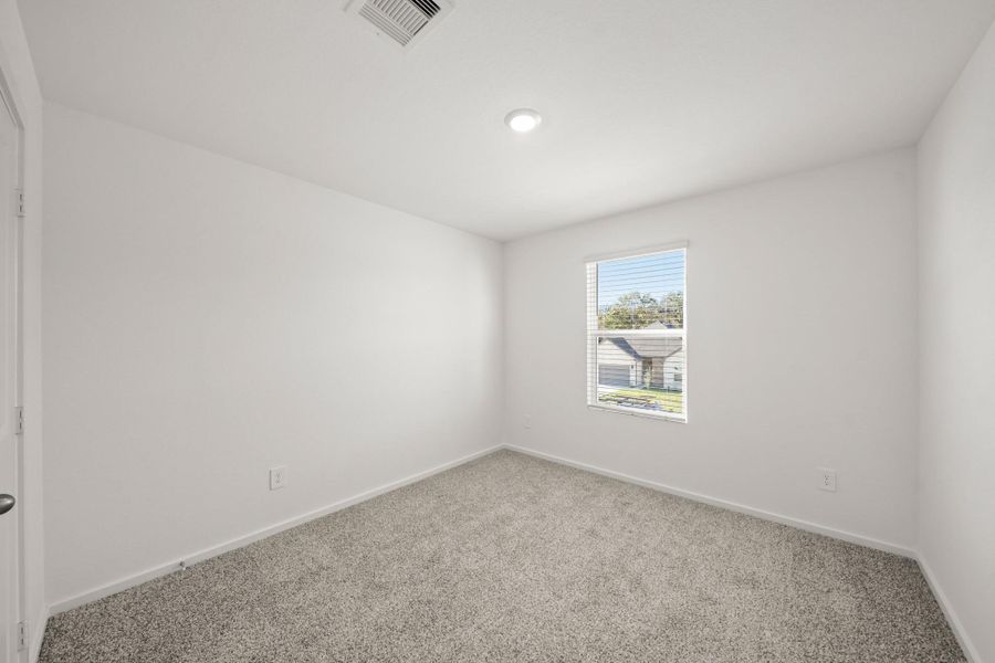 Spacious, unfurnished interior of a new home in The Canopies, Splendora (Image 9).