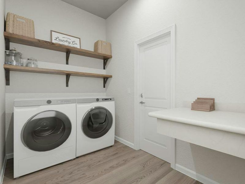 A laundry room with a drop zone is located at the garage entry.