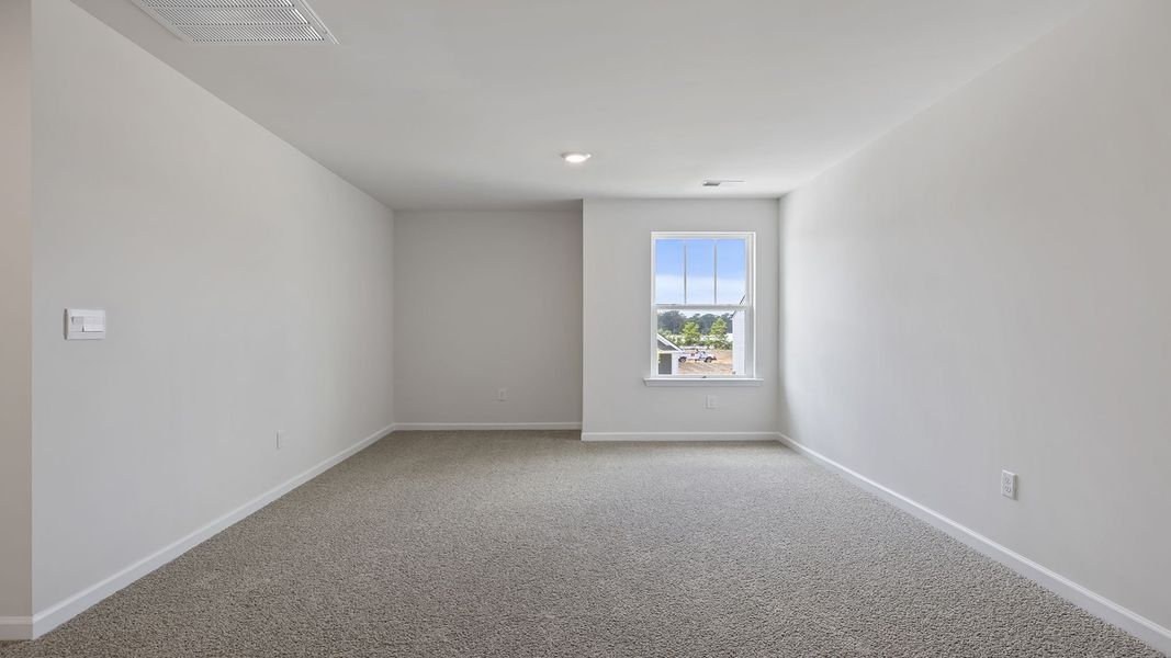 Spacious, unfurnished interior of a new home in Durbin Meadows Traditions, Fountain Inn (Image 23).
