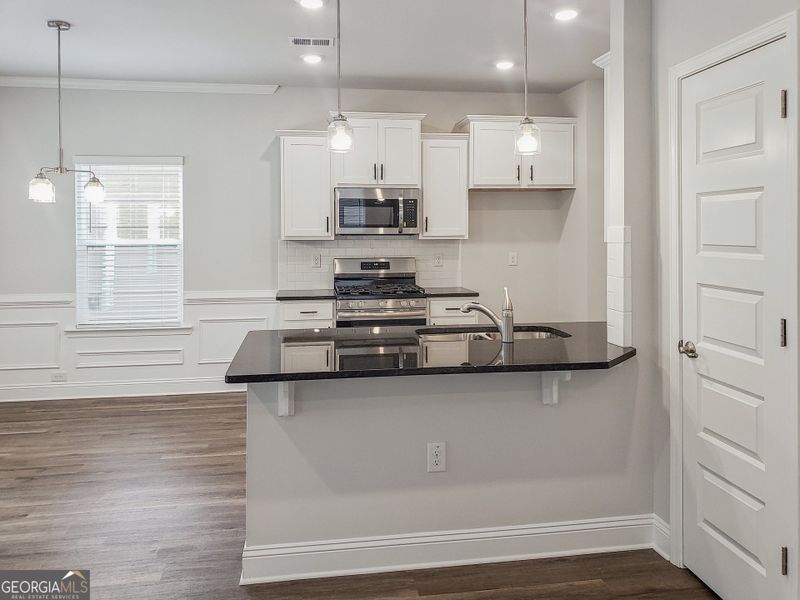Furnished interior view inside a new home in Windmill Park, Carrollton (Image 4).