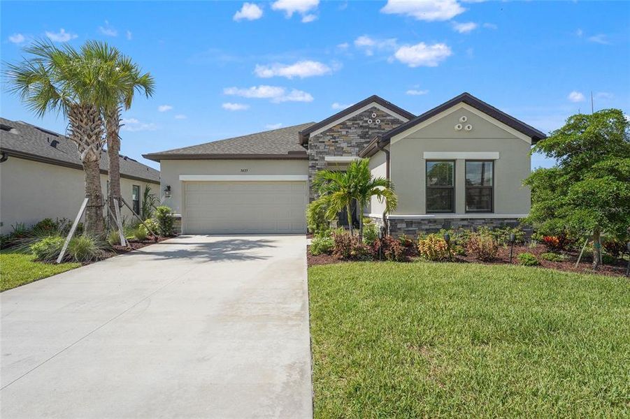 Front exterior of a new home in , Nokomis, FL, highlighting curb appeal (Image 24). Front exterior of a new home in , Nokomis, FL, highlighting curb appeal (Image 24).