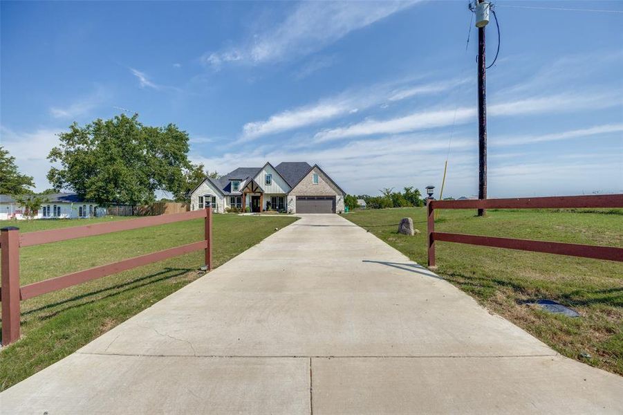 View of front of home featuring a garage and driveway