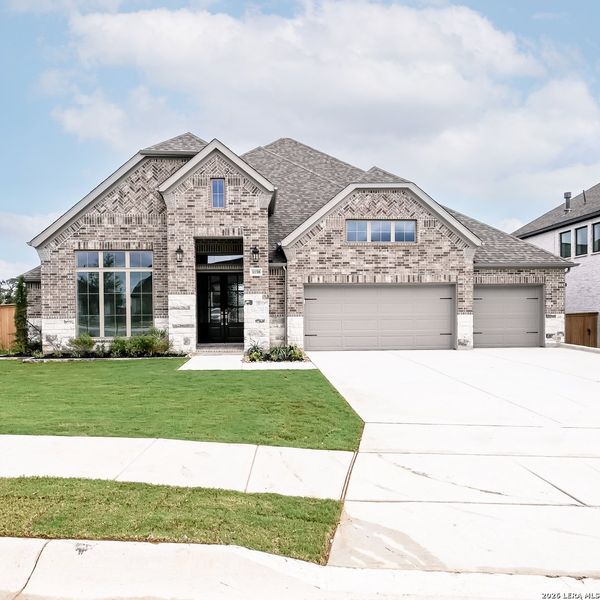 Front exterior of a new home in Johnson Ranch, Bulverde, TX, highlighting curb appeal (Image 22). Front exterior of a new home in Johnson Ranch, Bulverde, TX, highlighting curb appeal (Image 22).