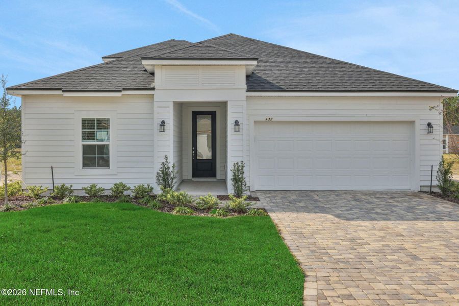 Front exterior of a new home in Brook Forest, St. Augustine, FL, highlighting curb appeal (Image 21).