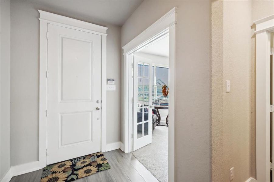 Foyer with light hardwood / wood-style flooring